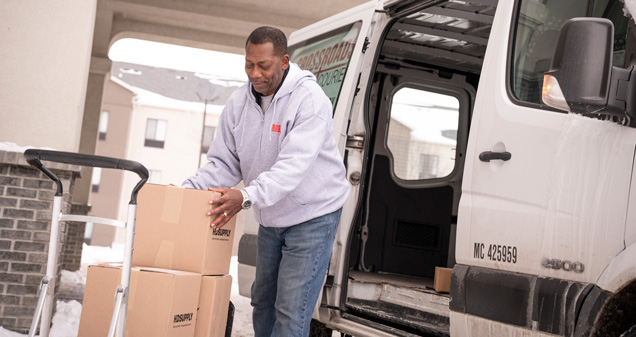 Crossroads Courier team preparing a shipment